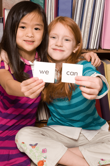 two girls practicing sight words